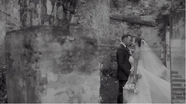 Nikky and Jake in a black and white portrait among ruins at Villa Bokeh