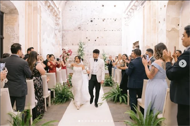 Bride and groom recessional through a ceremony in historic ruins